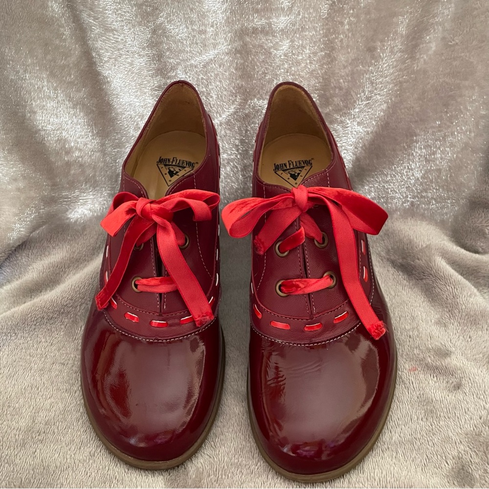 Deep Red John Fluevog patent leather shoes.